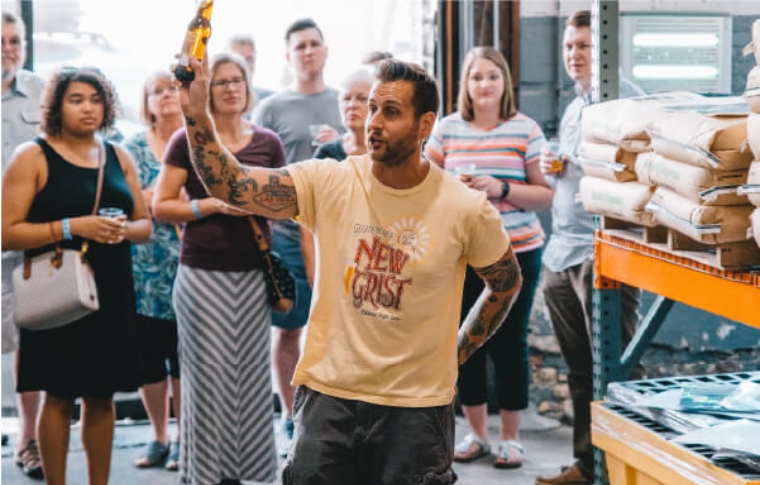 Untapped tour guide talking about the brewing process during brewery tour
